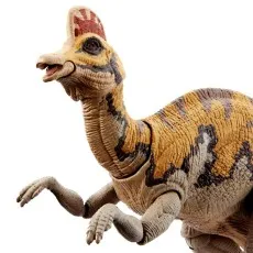 A close-up of a Corythosaurus dinosaur toy showing its head, red crest, and patterned skin.