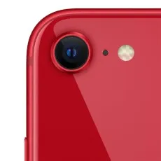 A close-up shot of the single camera lens on the back of a red iPhone SE 3rd Gen.