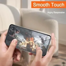 A person holding a smartphone horizontally, playing a high-action video game, highlighting a Smooth Touch screen