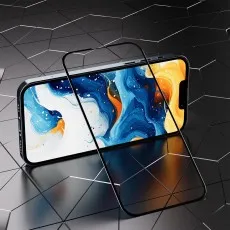 A clear screen protector rests on a phone displaying vibrant abstract art on a dark background