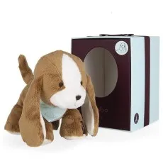 A cute brown and white plush puppy with long ears next to a gift box