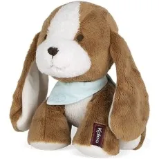 A soft brown and white puppy toy with long floppy ears and a blue scarf around its neck