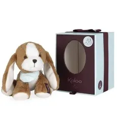A cute brown and white plush puppy with long ears next to a gift box