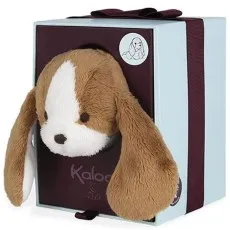 A fluffy brown and white plush puppy's head with long ears is peeking out of a square gift box