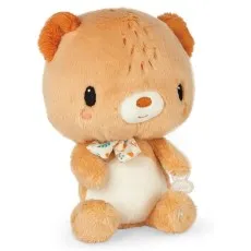 A plush light brown teddy bear with a white belly, wearing a patterned ribbon