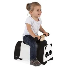 A toddler sits on a Janod wooden panda toy with a black seat and black handlebars, holding on