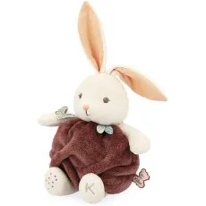 A stuffed rabbit with long ears and a fluffy brown body sits upright