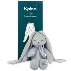 A plush gray bunny with long, floppy ears and a blue floral scarf sits in front of its dark teal box