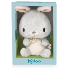 A cute toy bunny with pink ears and a colorful bow, sitting inside its brand-name display box..