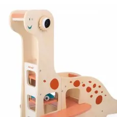 A wooden dinosaur toy with an orange spot pattern and a turquoise cactus figure beside it.