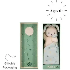 A beige plush bunny with mint green ears and a matching blanket with an orange floral pattern