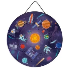 A smiling toddler boy sits on a wooden Janod balance bike with a number 17 on the front.