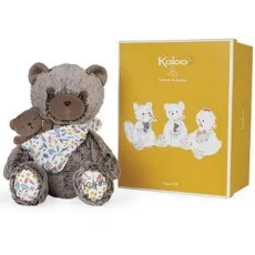 A fluffy gray bear holding a smaller brown bear, next to a yellow box