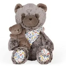 A close-up of a soft, gray teddy bear with a smaller, sleeping brown bear tucked under its arm