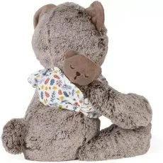The back of a gray teddy bear, showing a small brown bear tucked under its arm