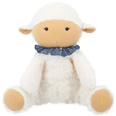 A soft, white, stuffed lamb toy with a beige face and feet, wearing a ruffled blue collar.