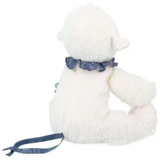The back of a fluffy white sheep plush toy with a blue ruffled collar and a patterned ribbon.