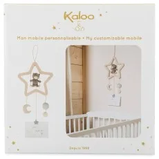 A baby mobile in its packaging, with a teddy bear inside a star-shaped wooden frame