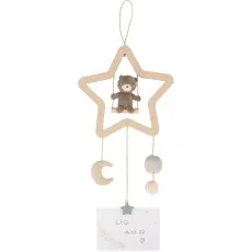A baby mobile featuring a teddy bear on a swing inside a star-shaped wooden frame