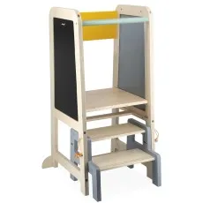 A children's two-step learning tower with a chalkboard and a yellow crossbar, and a gray top bar.
