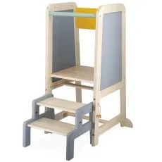 A child's hand turns a wooden gear on the neck of a Janod dinosaur toy with a happy face.