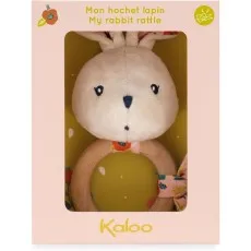 A baby rattle featuring a plush bunny head and a wooden ring, in its box