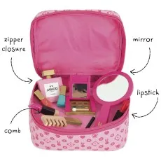 An open pink cosmetic bag is filled with a child's wooden toy mirror, lipstick, comb, and perfume.