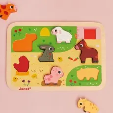 Wooden jigsaw puzzle with six farm animal shapes a cow, rabbit, chicken, pig, horse, and sheep