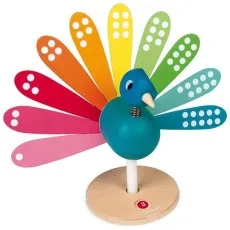 A Janod wooden toy of a peacock with removable, rainbow-colored feathers.