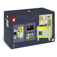 A Janod toy kitchen set is shown on its box. The yellow and mint green wooden kitchen has accessories and electronic features.