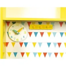 Detail of the play kitchen's backsplash, showing a white clock with green and yellow hands and a coat rack.