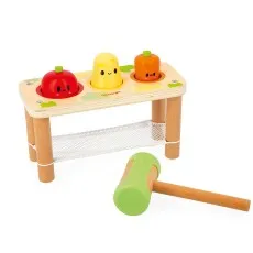 A mint green toy cup with foam art, a spoon, and a decorated cookie on a colorful speckled tray.