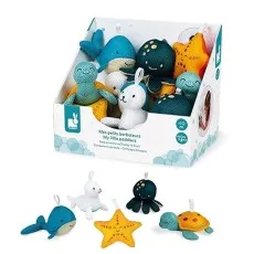 A collection of plush ocean animal bath scrubbers arranged in front of their display box.