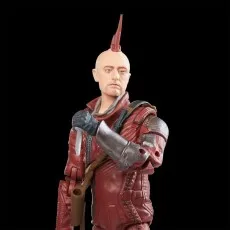 A close-up of a Kraglin action figure with a red mohawk, holding a dagger