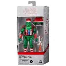 A holiday-themed Star Wars Stormtrooper action figure, complete with a red hat and candy cane stripes, inside its box.