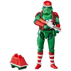 Holiday Stormtrooper action figure holding a blaster rifle with a small red and green droid beside it.