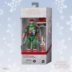 Packaged holiday Stormtrooper figure from The Black Series, showing the action figure and accessories through a clear window.