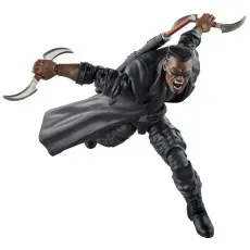 An action figure of Blade lunging forward with two bladed weapons, wearing a black trench coat and sunglasses