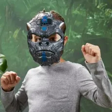 A boy wearing a grey shirt and a mechanical-looking Optimus Primal mask, posed like a fighter.