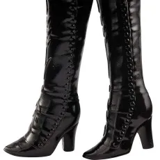 A close-up of a doll's shiny black boots with decorative buttons and heels