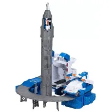 A Transformers playset with a gray rocket tower, a blue base, a ramp, and a tank vehicle