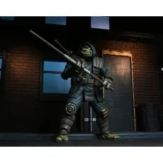 A detailed collectible toy of The Last Ronin wielding a long wooden staff.