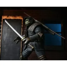 An action figure of a Ninja Turtle wearing an armored robe, holding a sword.