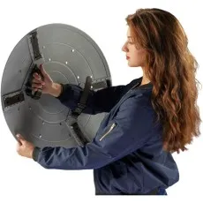 A woman holds the back of a Captain Carter shield with its arm straps visible.