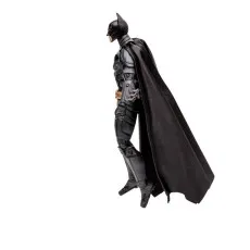 A Batman action figure from The Dark Knight Trilogy with its cape draped behind it, posed as if in a running or leaping motion