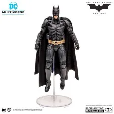 A fully articulated Batman action figure from The Dark Knight Trilogy in a black and dark gray suit with a flowing cape, displayed on a clear stand