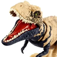 A close-up of a dinosaur toy, with its mouth open, revealing a red tongue and sharp teeth