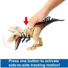 A hand presses down on a dinosaur toy to activate its side-to-side tracking motion