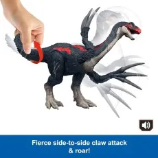 A hand twists the tail of a Therizinosaurus toy to activate its fierce side-to-side claw attack
