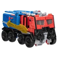 A three-quarters front view of the Optimus Prime figure in its truck mode, with the golden sword attached to its side